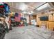 Spacious garage with ample storage, shelving, and a refrigerator for organization and convenience at 16863 Trail View Cir, Parker, CO 80134