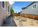 Charming backyard showcasing a unique garden design, rock landscaping, and a private, fenced-in yard at 16863 Trail View Cir, Parker, CO 80134