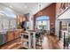 Bright, open kitchen featuring modern appliances, a stylish island with seating, and ample natural light at 16863 Trail View Cir, Parker, CO 80134
