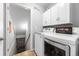 Functional laundry room with modern washer and dryer at 16863 Trail View Cir, Parker, CO 80134
