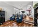 Open-concept living room with hardwood floors, bay window, and comfortable seating area, ideal for relaxation at 16863 Trail View Cir, Parker, CO 80134