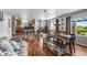 Open concept living space featuring hardwood floors, a dining area and a modern kitchen at 16863 Trail View Cir, Parker, CO 80134