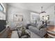 Bright living room featuring neutral tones, modern decor, and hardwood flooring at 16863 Trail View Cir, Parker, CO 80134