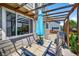 Relaxing outdoor patio with a pergola, dining table, grill, and garden—perfect for entertaining and enjoying the outdoors at 16863 Trail View Cir, Parker, CO 80134