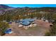 Aerial view of home on large lot with a deck and outdoor living at 6300 Summer Star Ln, Golden, CO 80403