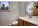 Bathroom features a modern sink, a vanity, and a window offering natural light and views at 6300 Summer Star Ln, Golden, CO 80403