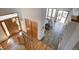 Grand foyer featuring wood floors, a staircase, and ample natural light highlighting the home's entry at 6300 Summer Star Ln, Golden, CO 80403