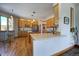 Well-lit kitchen with wood cabinets, stainless steel appliances, and hardwood floors for a warm, inviting feel at 6300 Summer Star Ln, Golden, CO 80403