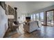 Inviting living room featuring slate flooring, wood burning fireplace, large windows and comfortable seating at 6300 Summer Star Ln, Golden, CO 80403
