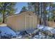 Exterior view of an outbuilding with double doors and a concrete foundation at 6300 Summer Star Ln, Golden, CO 80403