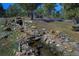 Natural stream with rock features flows through the wooded landscape at 6300 Summer Star Ln, Golden, CO 80403