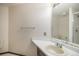 This bathroom features a single sink vanity and a tiled shower at 13486 Clayton St, Thornton, CO 80241