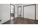 A modest bedroom with a large closet is adjacent to the bathroom and hallway at 13486 Clayton St, Thornton, CO 80241