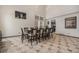 Spacious dining room with tile floors and a large window at 13486 Clayton St, Thornton, CO 80241