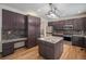 Spacious kitchen featuring a center island, granite counters, and modern appliances at 13486 Clayton St, Thornton, CO 80241