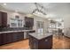 Well-equipped kitchen featuring a center island, granite counters, and stainless appliances at 13486 Clayton St, Thornton, CO 80241