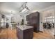 Well-equipped kitchen featuring a center island, granite counters, and modern appliances at 13486 Clayton St, Thornton, CO 80241