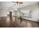 The large living area features hardwood floors, lots of light and access to the bath and hallway at 13486 Clayton St, Thornton, CO 80241