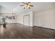 Spacious living room with wood floors, vaulted ceilings, two ceiling fans, and a comfortable atmosphere at 13486 Clayton St, Thornton, CO 80241