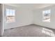 Comfortable bedroom with plush carpeting and bright windows offering lovely views at 22036 E 39Th Pl, Aurora, CO 80019