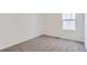Cozy bedroom with plush carpeting and a bright window at 22036 E 39Th Pl, Aurora, CO 80019