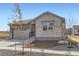 Attractive single-Gathering home with a two-car garage, stone veneer, and a well-manicured lawn at 22036 E 39Th Pl, Aurora, CO 80019
