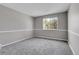 Neutral-toned bedroom with a large window and plush carpet is comfortable and relaxing at 14473 E Jewell Ave # 202, Aurora, CO 80012