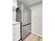 Modern kitchen featuring new stainless steel refrigerator, cabinets, and hardwood floors at 14473 E Jewell Ave # 202, Aurora, CO 80012