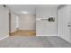 Open-concept living room with views of the entry and kitchen is well lit and modern at 14473 E Jewell Ave # 202, Aurora, CO 80012