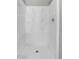 Walk-in shower with seamless white design is perfect for a relaxing experience at 14473 E Jewell Ave # 202, Aurora, CO 80012