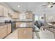 Bright eat-in kitchen boasts granite counters, an island with seating, and stainless steel appliances at 8408 Everett Way # B, Arvada, CO 80005