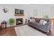 Relaxing living room featuring a fireplace and hardwood floors at 8408 Everett Way # B, Arvada, CO 80005