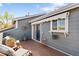 Charming outdoor patio space with sliding glass door and serene ambiance for relaxing and entertaining at 8408 Everett Way # B, Arvada, CO 80005