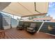 Relaxing patio area with comfortable seating and retractable awning for shade on sunny days at 8408 Everett Way # B, Arvada, CO 80005