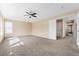 Large carpeted bedroom with a ceiling fan, and lots of natural light at 24676 E Florida Ave, Aurora, CO 80018