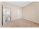 Neutral bedroom featuring plush carpeting and a spacious closet at 24676 E Florida Ave, Aurora, CO 80018