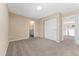 Neutral bedroom featuring carpet, a closet, and an en-suite bathroom at 24676 E Florida Ave, Aurora, CO 80018