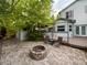 Charming backyard featuring a fire pit, comfortable seating, and a wooden deck area at 2720 E 121St Pl, Thornton, CO 80241