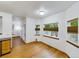 Bright dining area with wood floors and large windows offering natural light and views at 2720 E 121St Pl, Thornton, CO 80241
