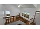 Bright hallway with wood floors, stairs, and natural light from multiple windows at 2720 E 121St Pl, Thornton, CO 80241