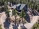 Stunning aerial view of a home nestled among the trees, showcasing its picturesque setting at 538 Sawmill Creek Rd, Evergreen, CO 80439
