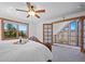 Inviting bedroom with beautiful balcony access offering views of the mountains at 538 Sawmill Creek Rd, Evergreen, CO 80439