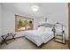 Cozy bedroom features a comfortable bed, a large window with scenic views, and stylish decor at 538 Sawmill Creek Rd, Evergreen, CO 80439