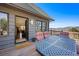 Outdoor deck featuring patio furniture with incredible views of the surrounding mountains at 538 Sawmill Creek Rd, Evergreen, CO 80439