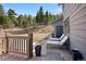 Inviting deck with outdoor seating provides stunning views of the natural surroundings, perfect for relaxation at 538 Sawmill Creek Rd, Evergreen, CO 80439