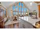 Open-concept dining room with vaulted ceilings, hardwood floors, and views at 538 Sawmill Creek Rd, Evergreen, CO 80439