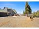 Charming mountain home with a green roof and a lovely wooded landscape, deer in the yard at 538 Sawmill Creek Rd, Evergreen, CO 80439