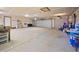 Spacious three-car garage with high ceilings and ample storage space at 538 Sawmill Creek Rd, Evergreen, CO 80439