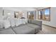 Spacious living room offers a comfortable sectional sofa and stunning views of the surrounding mountains at 538 Sawmill Creek Rd, Evergreen, CO 80439
