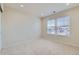 Neutral bedroom with plush carpet, bright windows, and ample space at 9435 E 108Th Pl, Commerce City, CO 80640
